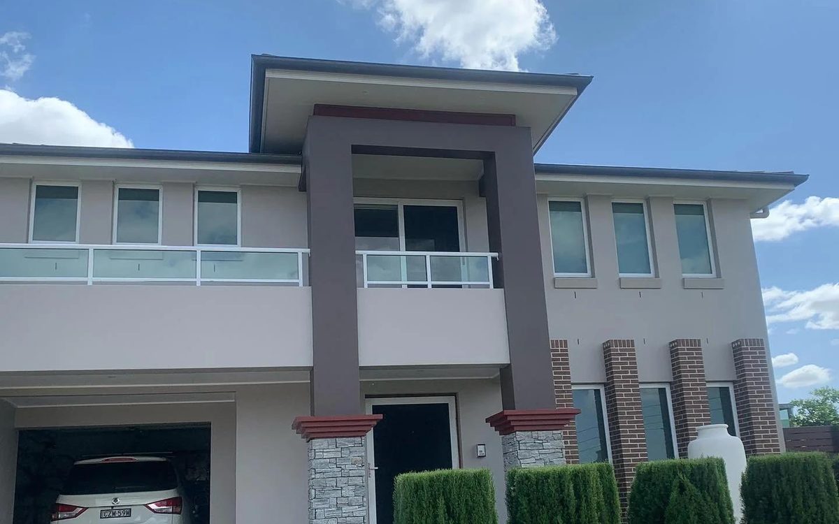 Two-storey home with a freshly painted exterior by Atlantic Painting